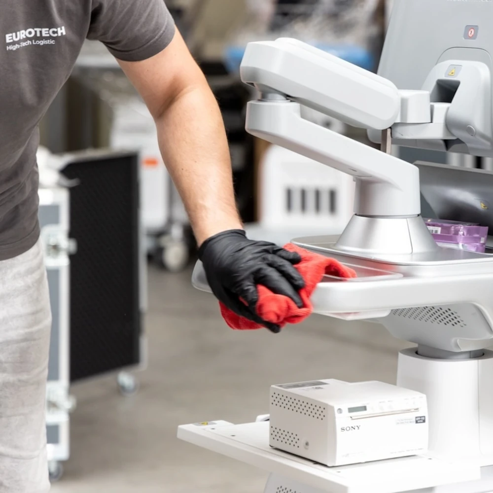 Eurotech logistics employee preparing a medtech machine for logistics.