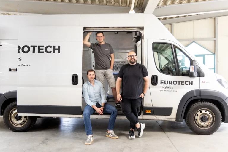 Eurotech transport solutions employees in front of a Eurotech tansporter