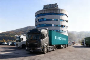 Eurotrans logistics company from Austria with trucks parking in front of the building
