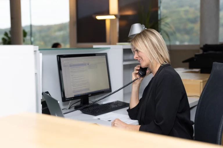 Eurotrans employee answering logistics requests on the phone